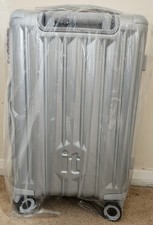 Image of New Never Opened It Silver Hard Shell 4 Wheel Medium Suitcase