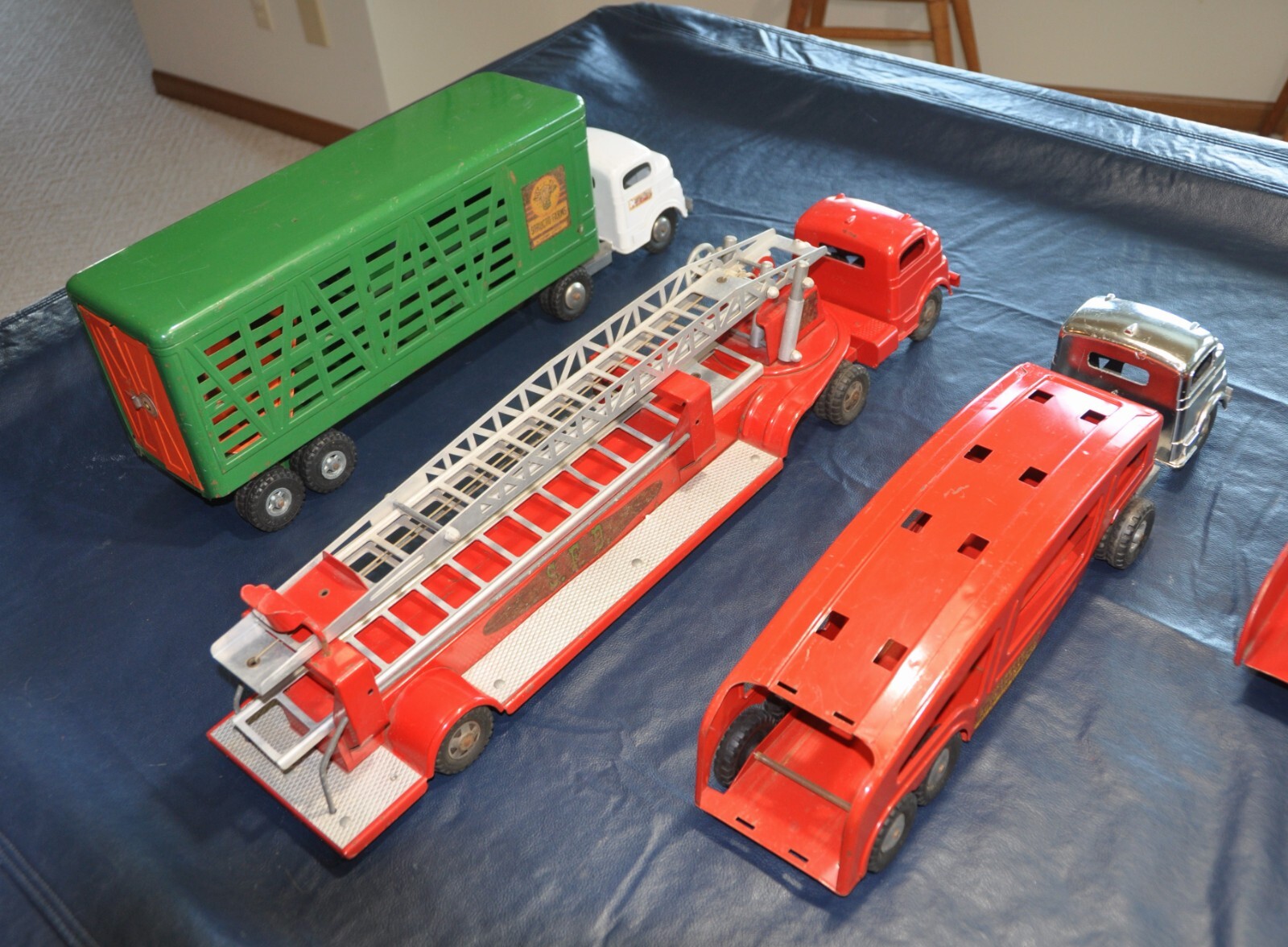 9 Vintage 1950's Structo Toy Trucks, good to very good condition for