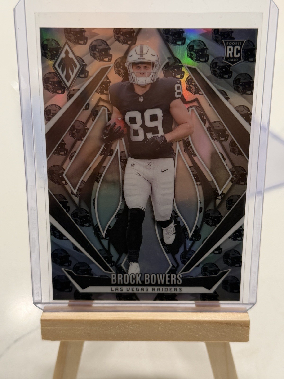 2024 Panini Phoenix - Rookies Brock Bowers #165 Team Helmet /399 (RC)