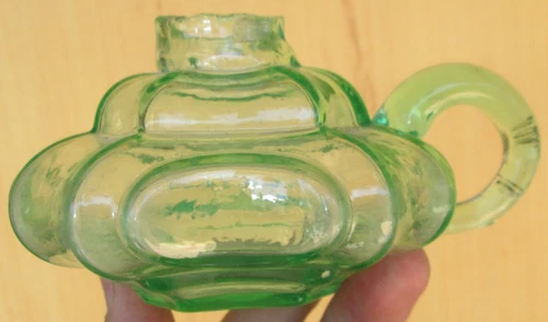 Beautiful depression green glass handled finger lamp