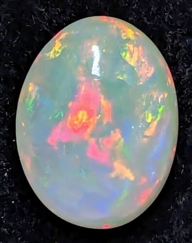 3.8ct Welo Opal Oval Cabochon AAA Rainbow Red Flash Loose Ethiopian VIDEO - Picture 4 of 7