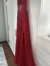 A sexy hot red dress hugs the curves of the body in all the right places