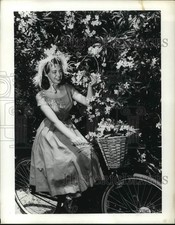 1955 Press Photo Joan Bennett, future wife of Ted Kennedy, on bicycle in Bermuda