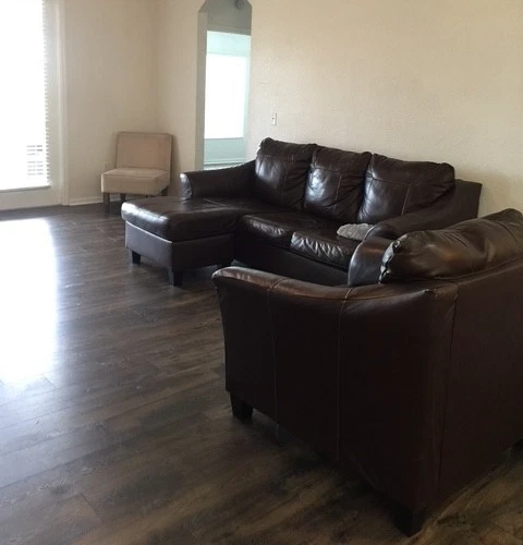 2 Piece Ashley Leather Sofa Chaise Queen Sleeper And Chair in Good Condition - Image 2 of 2