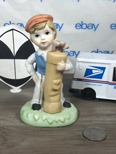 Vintage Boy with golf bag with clubs figurine
