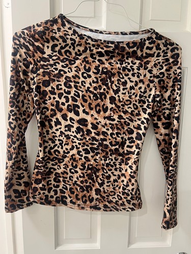 Leopard print top size S/M. So cute under a jacket or by itself.