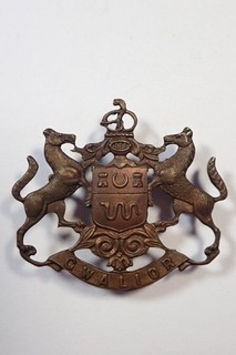 India: Gwalior State Forces original Headress Badge.
