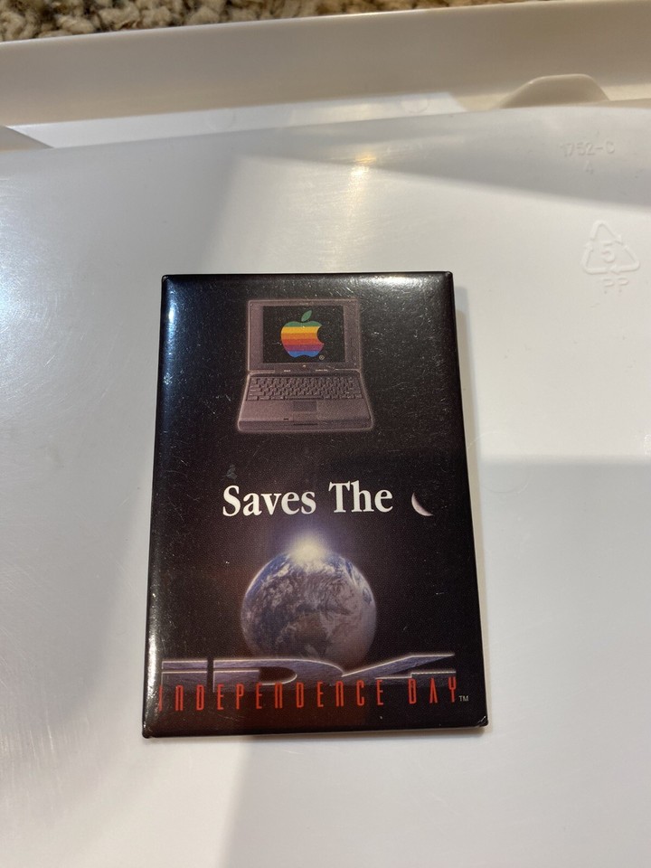 A 1996 Macworld Expo Apple promo pin with a 'Save the Planet' message — tiny, cheap, and a genuine relic from Apple's scrappy pre-comeback era.