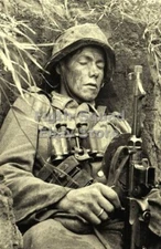 WW2 Picture Photo German soldier sleeping in a trench 5999