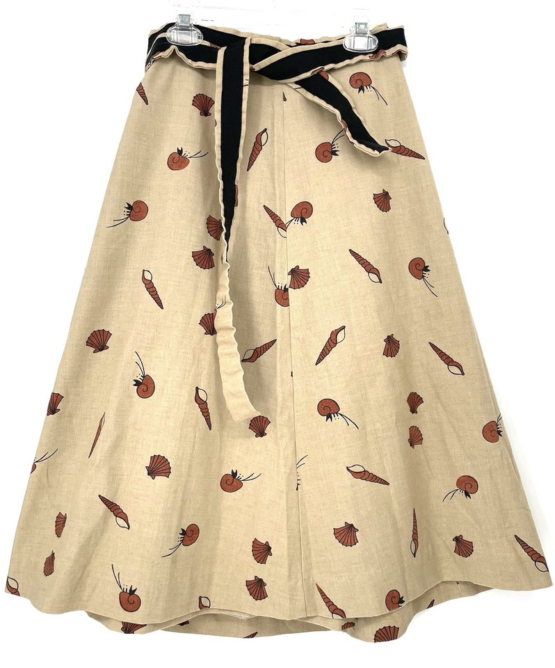 A breezy 80s novelty wrap skirt printed with sea shells and crabs — the kind of wearable kitsch that's totally back in style.