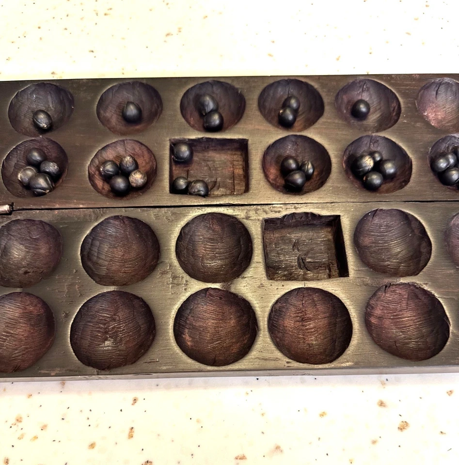 Juego de mesa Bao Mancala con 42 semillas talladas a mano en madera con diseño de elefantes rinocerontes Foto 2 de 4