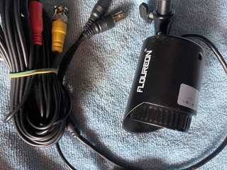 wired FLOUREON analog CCTV security camera along with its combined cable.