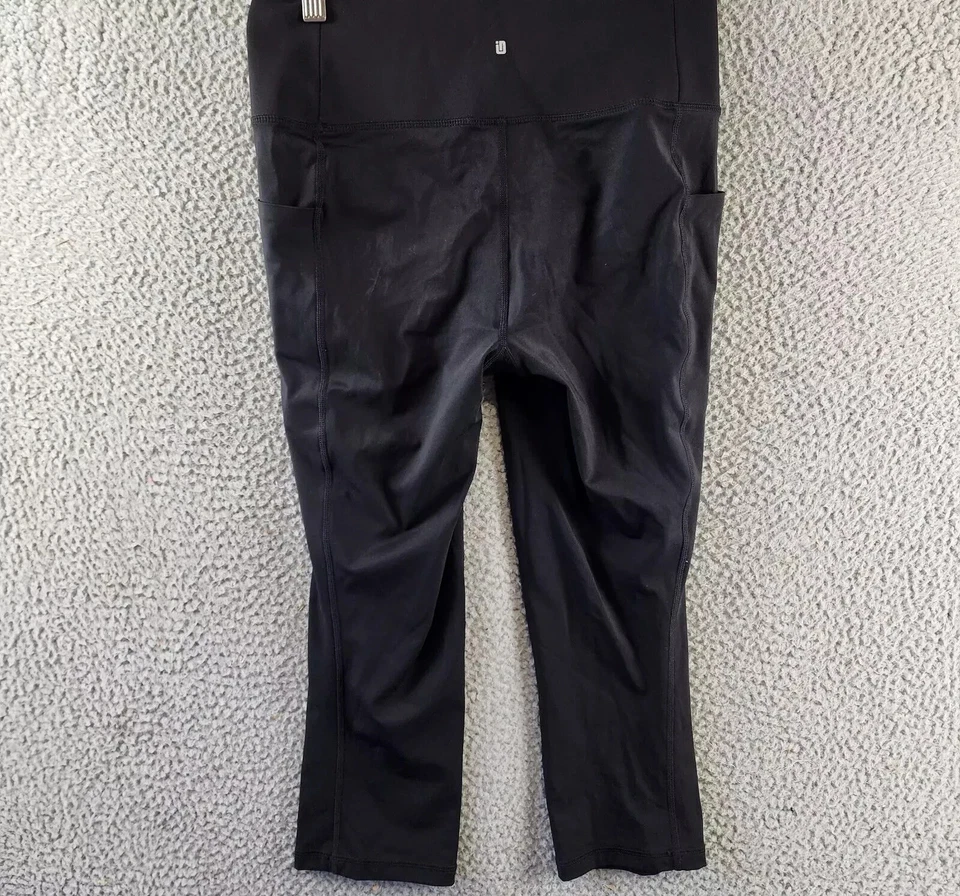 Legging corto suave ID Ideology para mujer S negro bolsillo lateral cintura elástica tirar Foto 2 de 4