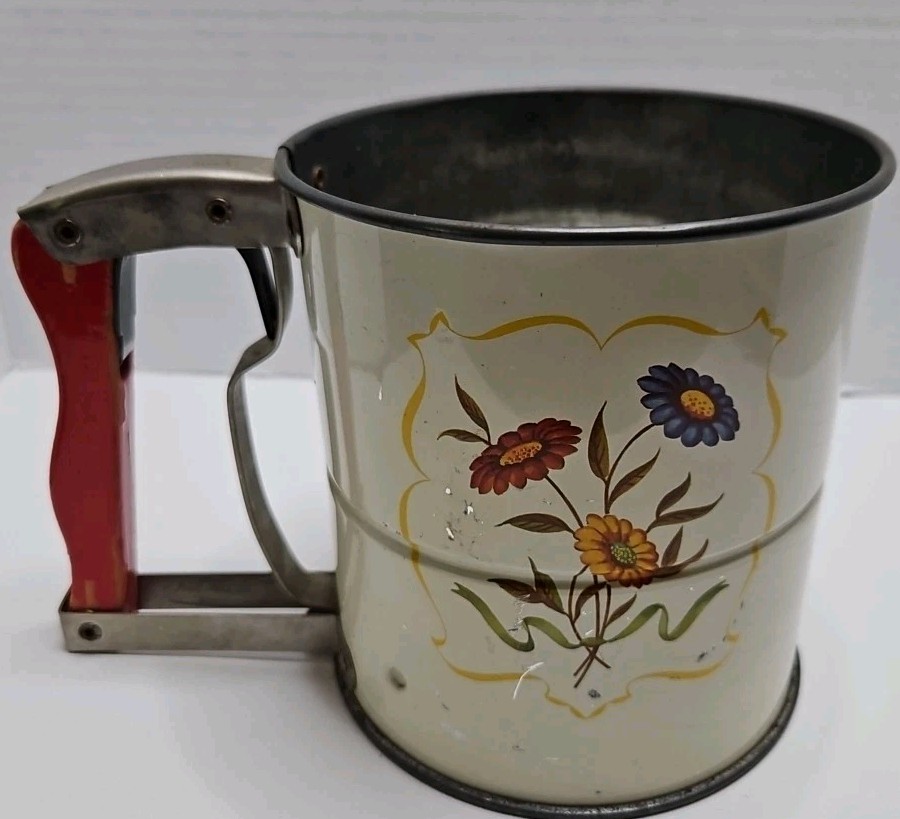 A triple-screen flour sifter with a charming floral design that actually works — the kind of beautiful, functional vintage bakeware that makes baking feel like an event.