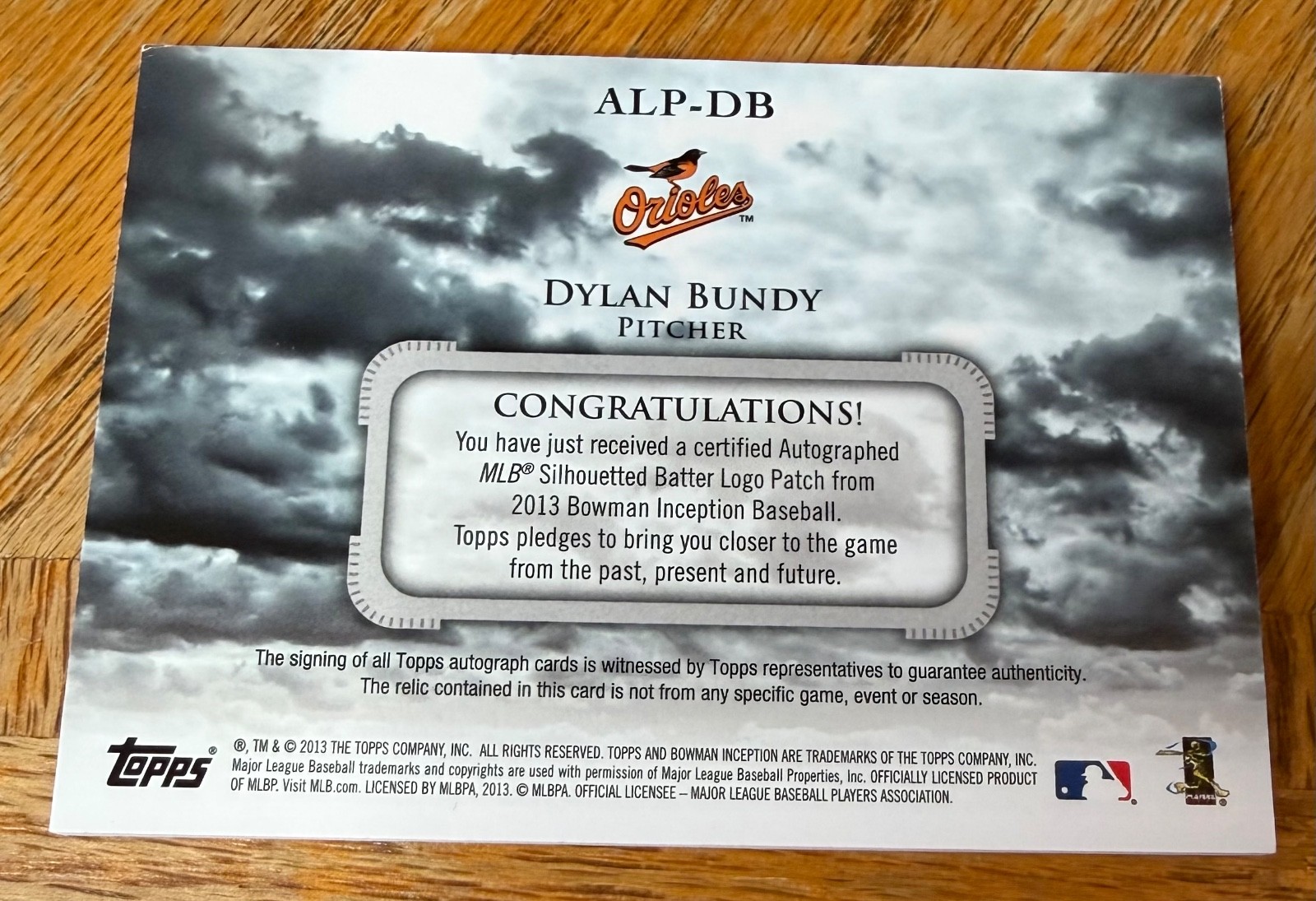2013 Topps Bowman Inception Dylan Bundy Game Worn Silhouetted Logo auto 1/1 view 3