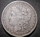 1882 O US Morgan Silver Dollar,  .900 fine, dinged rim, ave cir. condition