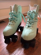 Blue roller skates, Woman's size 10, Hardly worn- in new condition