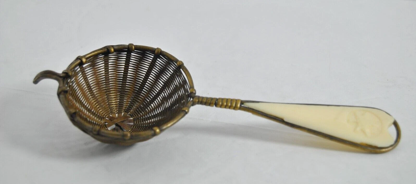 Vintage Tea Strainer Handwoven Brass White Handle Maple Leaf Design 6" by 2"
Opens in a new window o