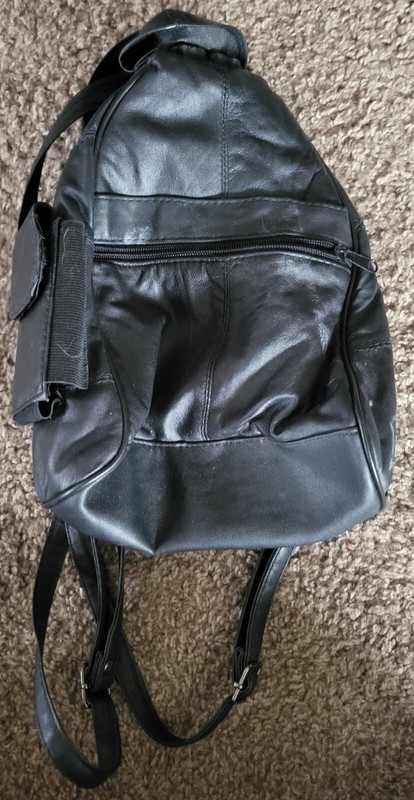 SMALL LEATHER BACK-PACK W3ITH MANY OUTSIDE POCKETS