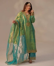 Pakistani Style Soft Twill Net Silk Top Palazzo With Dupatta For Reception Wear