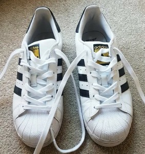 adidas white trainers black stripes