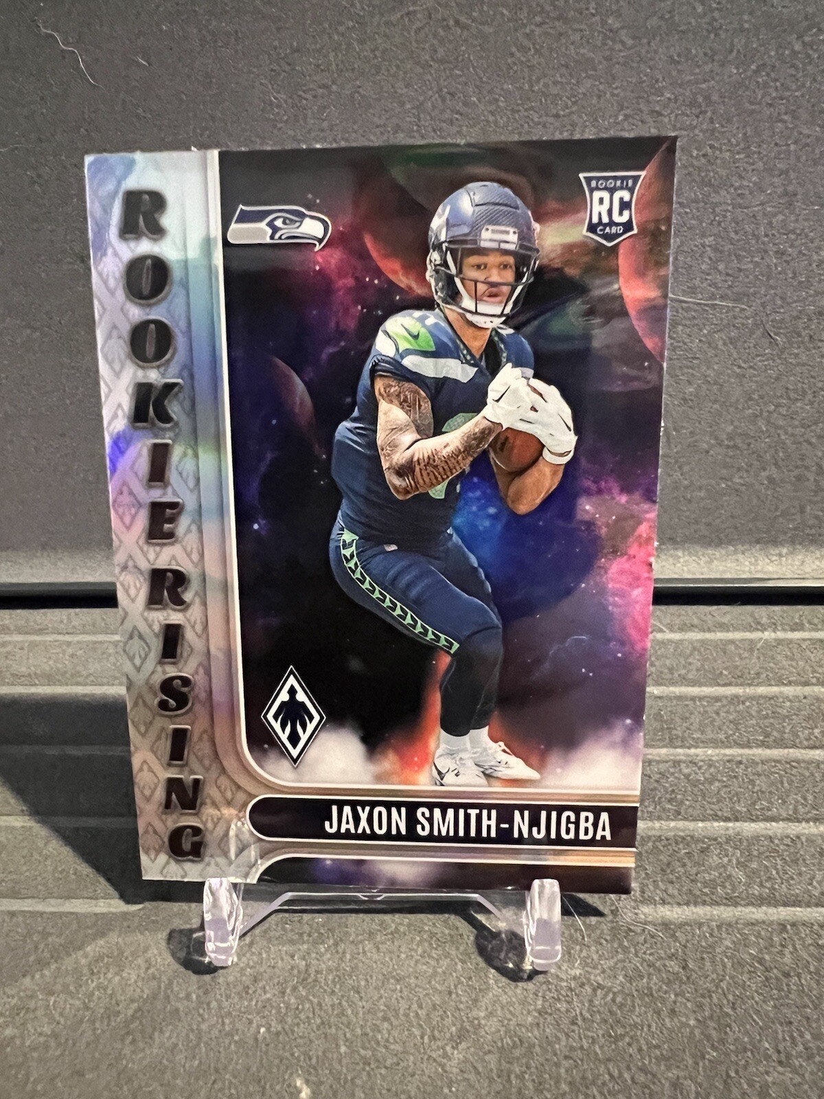 2023 Panini Phoenix Jaxon Smith-Njigba (RC) Rookie Rising #RIS-9 Seahawks