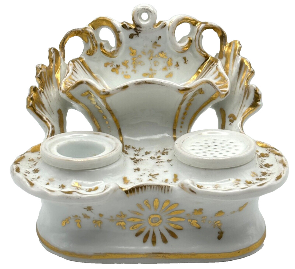 A two-piece porcelain inkwell and sand shaker set with gold trim — a genuinely rare writing desk duo that most people have never seen in person.