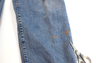 Blue VTG Lucky Brand jeans with 34x30 medium wash, featuring brown paint splatter on the left leg.
