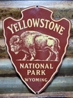 VINTAGE YELLOWSTONE PORCELAIN SIGN OLD NATIONAL PARK WYOMING BISON ARROWHEAD 12"
