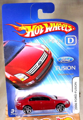 2006 Hot Wheels Life in D FORD FUSION Dark Red w/Chrome PR5 Spoke Wheels