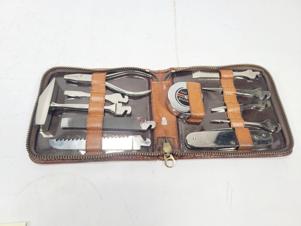 An 11-piece vintage Hubeo pocket tool kit in a Mark Cross leather case — a complete, luxurious gentleman's kit from a heritage brand that feels like a prop from a spy film.