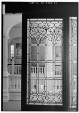 20. LOOKING FROM STUDY THROUGH LEADED GLASS DOOR ONTO SECOND FLOOR BALCONY. -