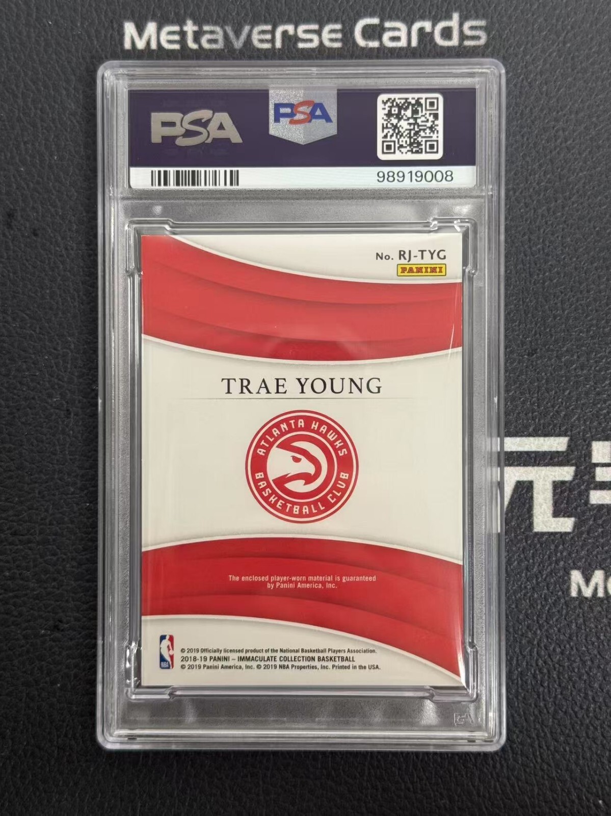 2018-19 Immaculate Trae Young RC Rookie Jersey Gold Patch 01/10 PSA 8 Game Worn view 2