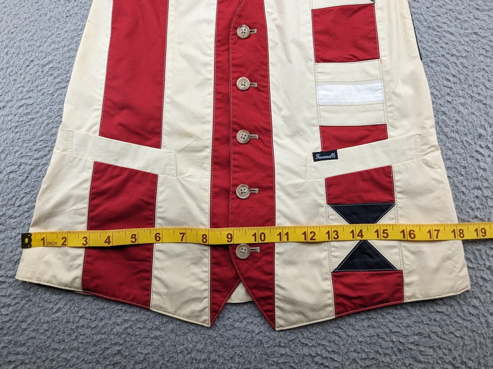 Beige Faconnable vest women’s medium with red, white, and blue nautical pinstripes, button front, and two flap pockets.