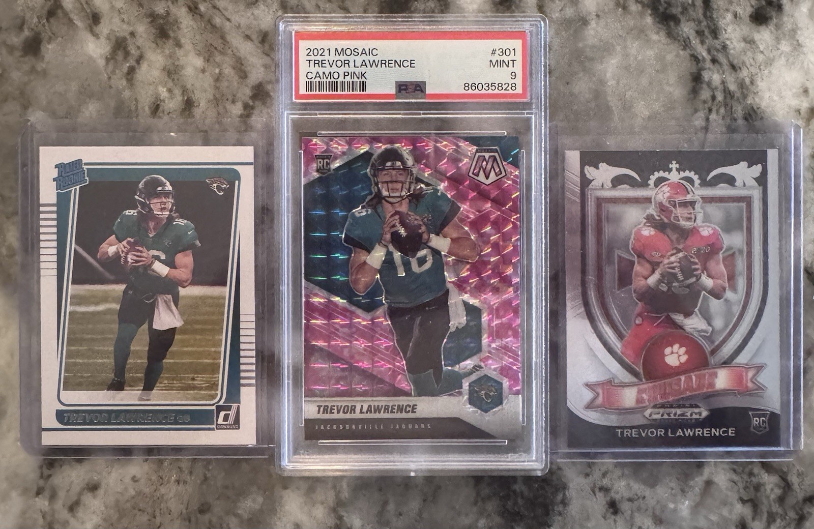 2021 Panini Mosaic - Rookies Trevor Lawrence #301 Camo Pink Mosaic (RC) PSA 9