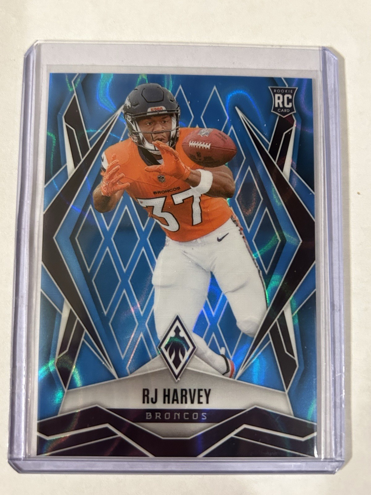 2025 Panini Phoenix - Rookies RJ Harvey #176 Light Blue Lava /325 (RC)