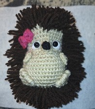 homemade crocheted hedgehog with pink bow