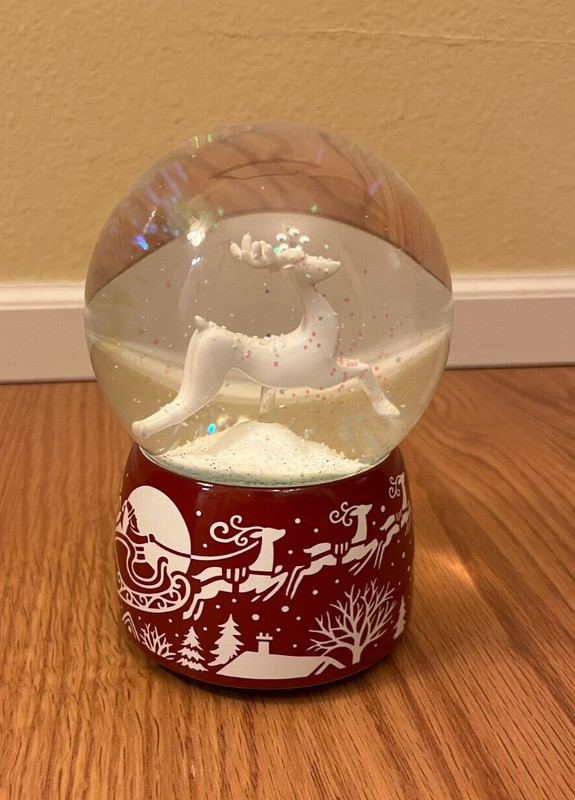 Santa reindeer sleigh musical glitter red white Christmas snow globe
