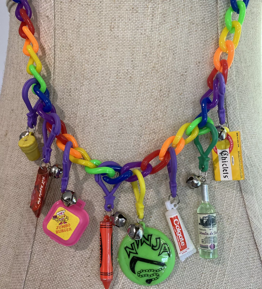 Plastic necklace with best sale charms from the 80's