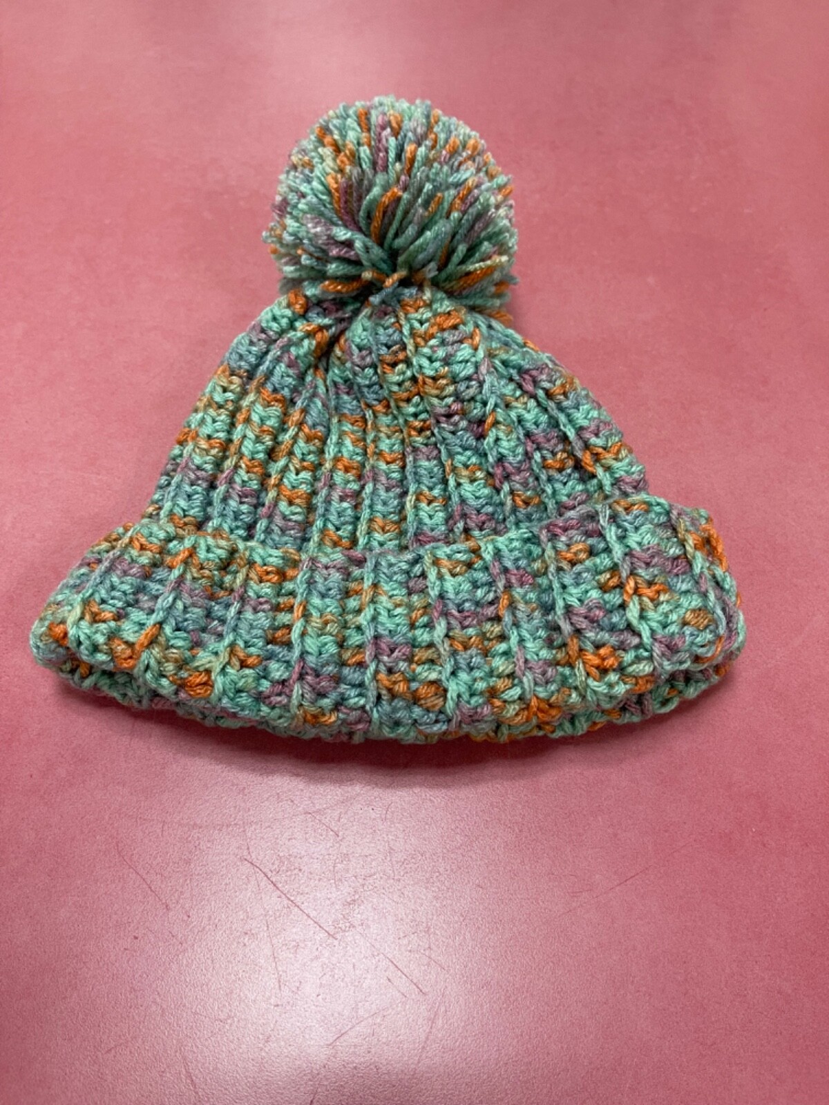 Handmade crochet beanie with colorful pompom - cozy & stylish-image