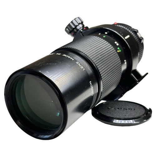 Return  Canon MACRO LENS NEW FD 200mm F4 with front and rear caps tripod mount