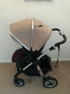 beige silver cross pram