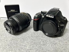 Nikon D5200 digital single lens reflex camera used with lens