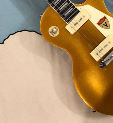 Low-price sale. Golden 6-string electric guitar with P90 pickups and 22 frets.