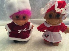 2 Russ Christmas troll dolls. Velvet outfit and red dress with apron. Pink hair