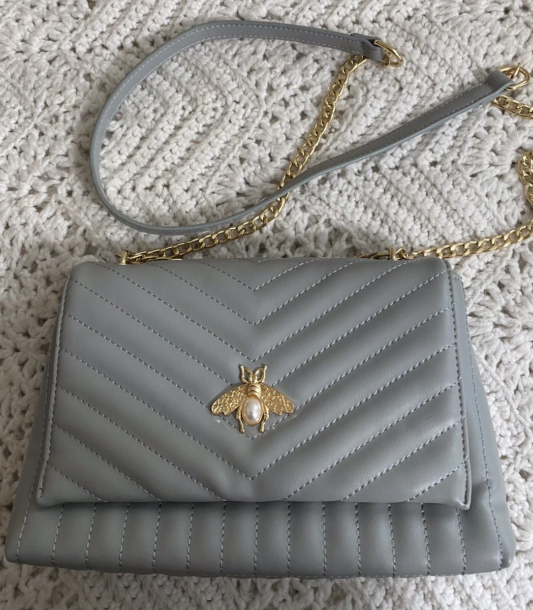 Crossbody and shoulder straps with pearl chain