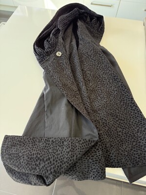 Reversible Spring/Rain Coat. It s meant to fit a range of sizes: average of L