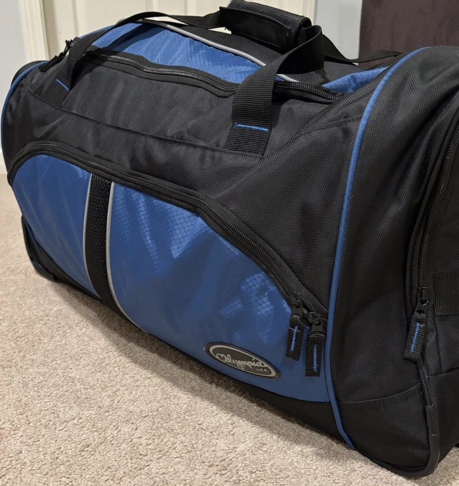 Bolsa de viagem Olympia U.S.A. 29" com rodas jumbo azul e preta - Imagem 3 de 4