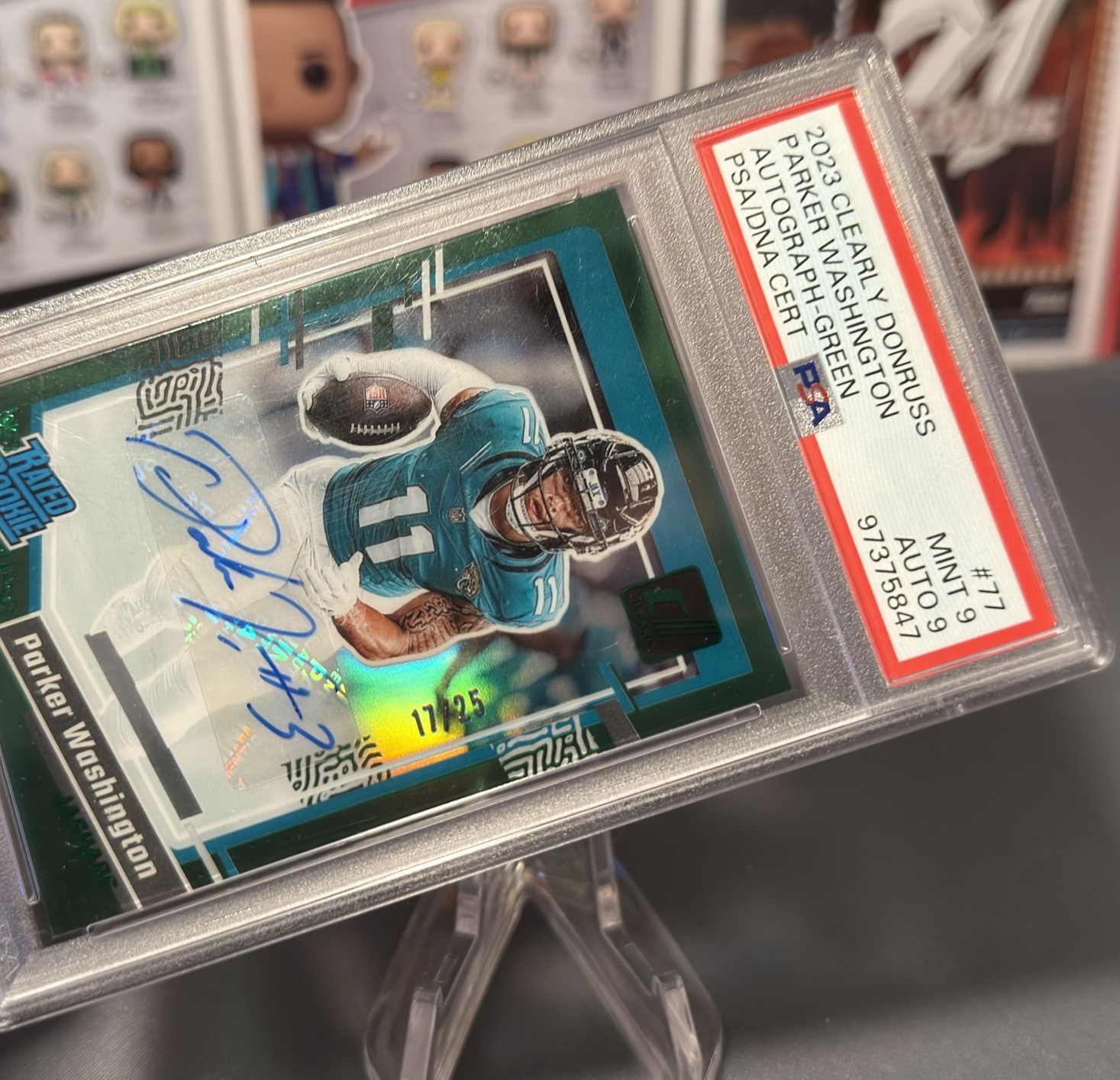 2023 Panini Donruss Clearly Parker Washington Rated Rookie Auto Green /25 PSA 9 view 2