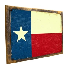 Wood-Framed Texas Flag Metal Sign Mounted on Rustic, Weathered Wood